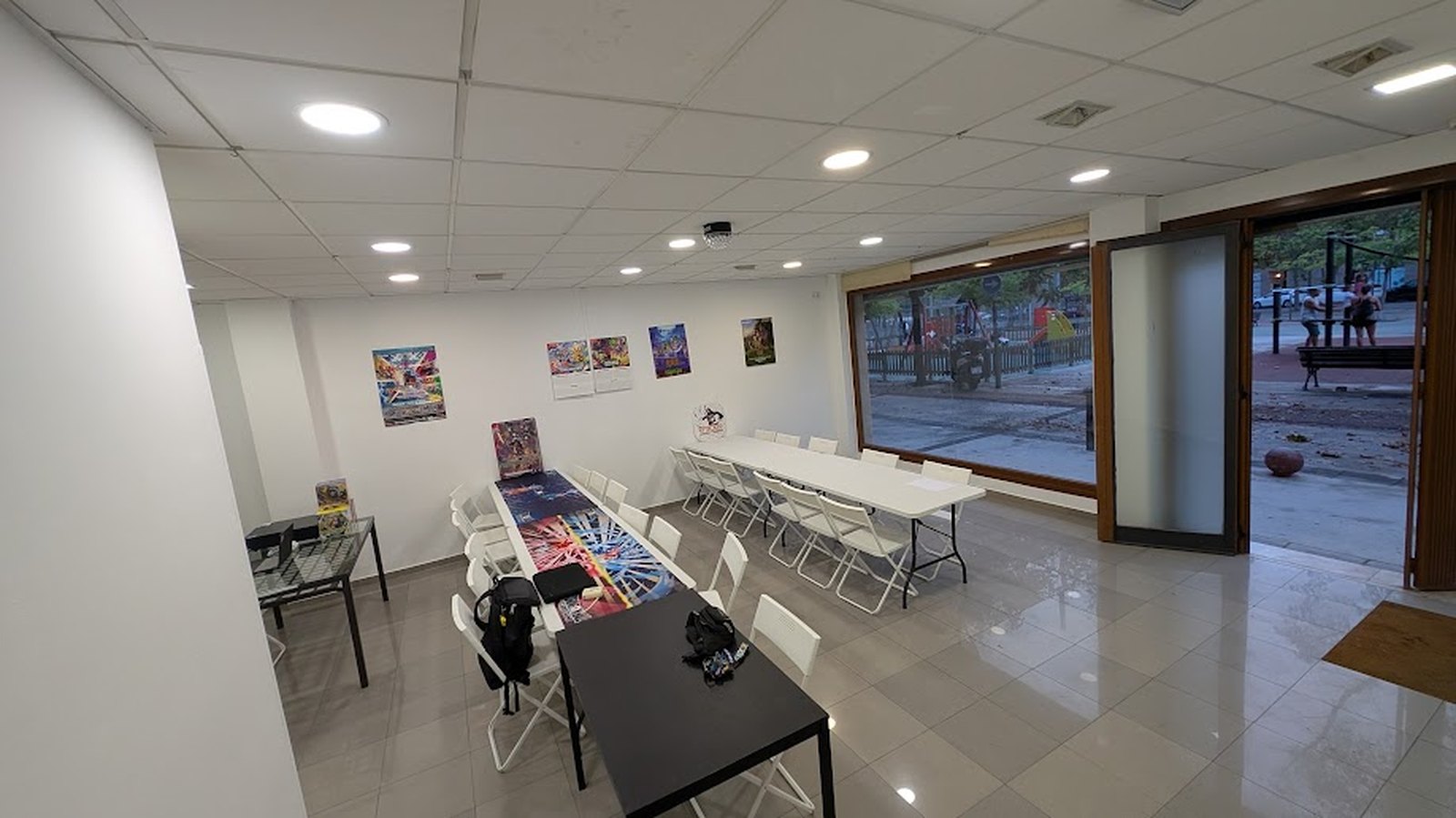 A third view of the Spaceship TCG floor in Barbera del Valles, tables set for play